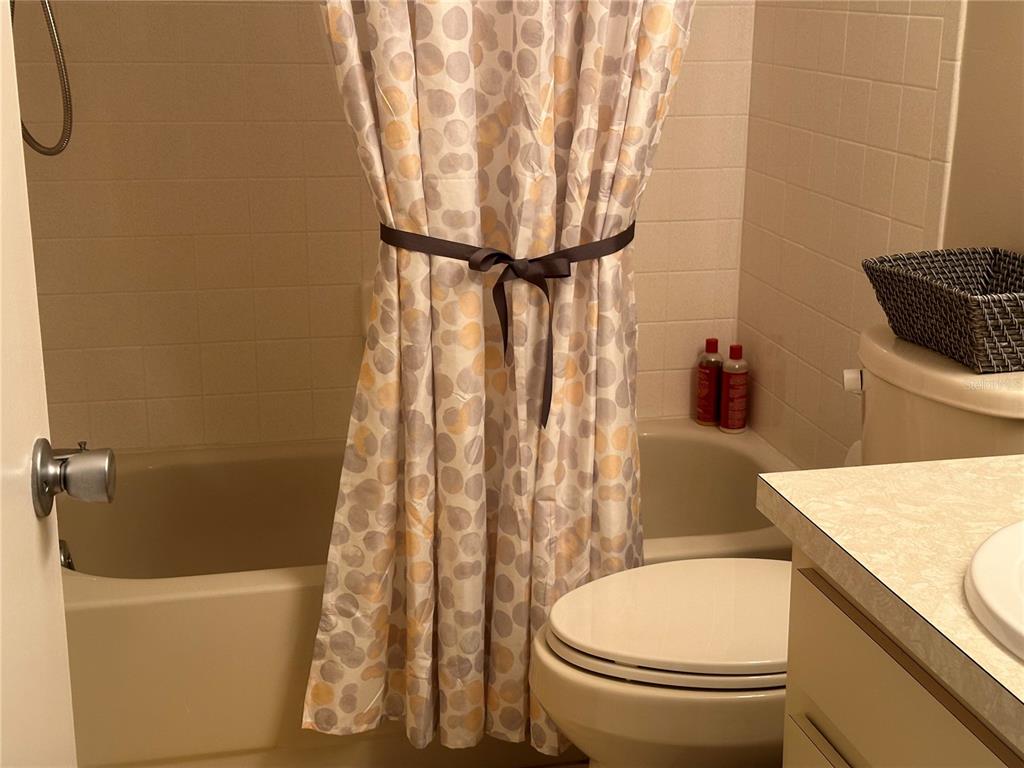 8680 Southwest 94 Lane, Unit G Ocala, FL 34481 - Photo 18 of 24 a bathroom with a toilet and a sink