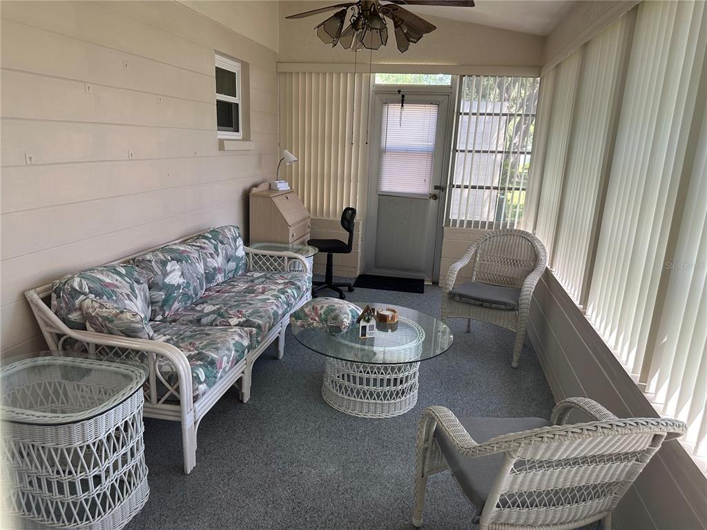 8680 Southwest 94 Lane, Unit G Ocala, FL 34481 - Photo 24 of 24 a living room with furniture and a window