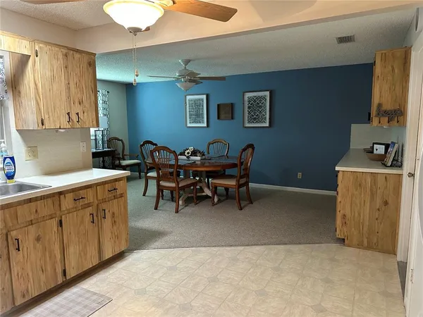 a kitchen with sink and cabinets