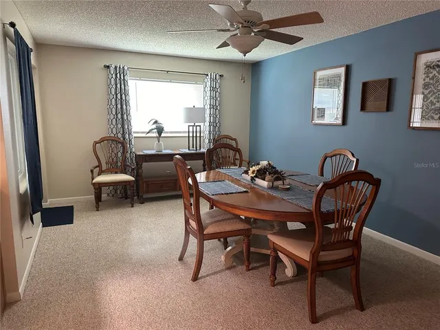 a dining room with furniture and window