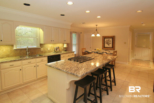 506 Oak Ridge Court West Daphne, AL 36526 - Photo 3 of 31 Amazing Kitchen, offers: Oversized Island, with a Breakfast Bar, Gas Range, Breakfast Area, Built in China Cabinet & desk area.