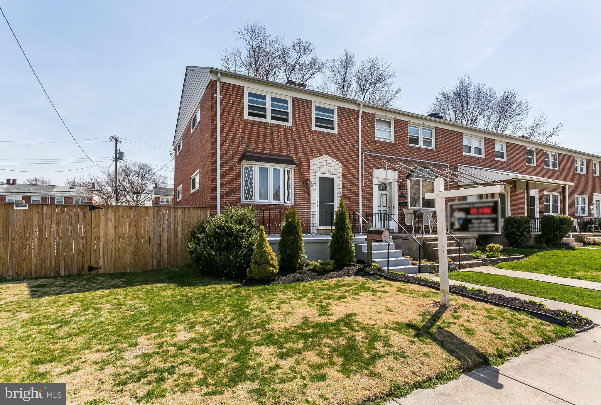 8511 Kings Ridge Road Baltimore, MD 21234 - Photo 1 of 30 a front view of a house with a yard
