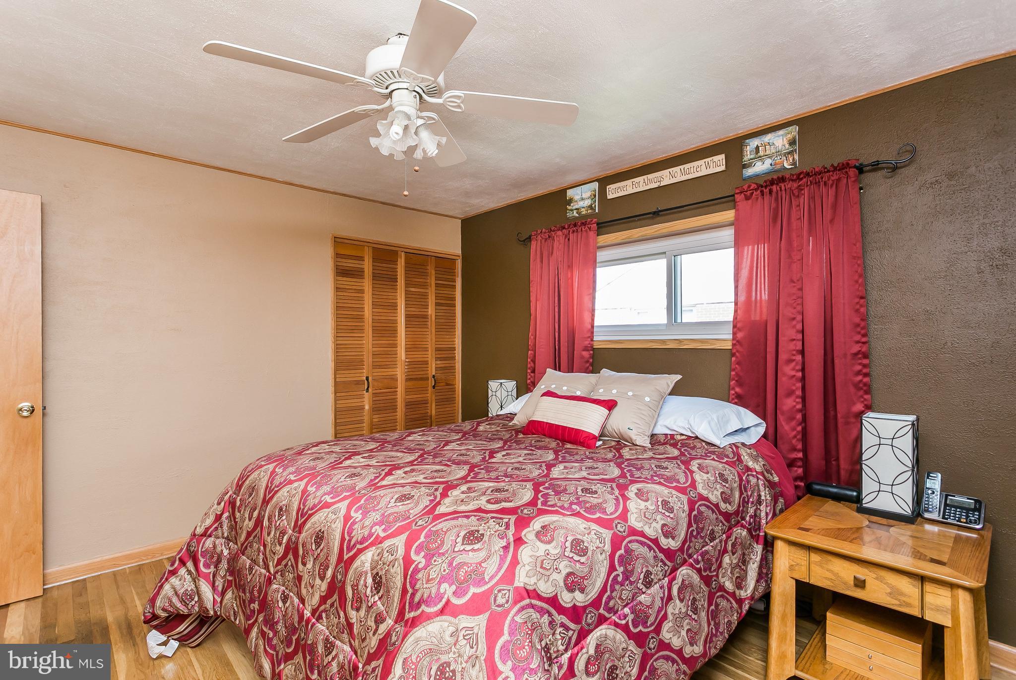 8511 Kings Ridge Road Baltimore, MD 21234 - Photo 14 of 30 a bedroom with a bed and a window