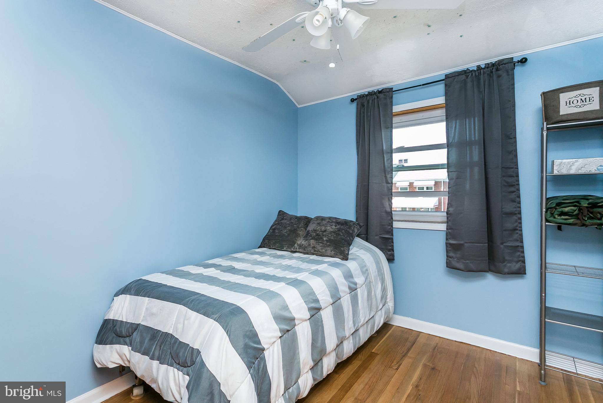 8511 Kings Ridge Road Baltimore, MD 21234 - Photo 18 of 30 a bedroom with a bed and a window