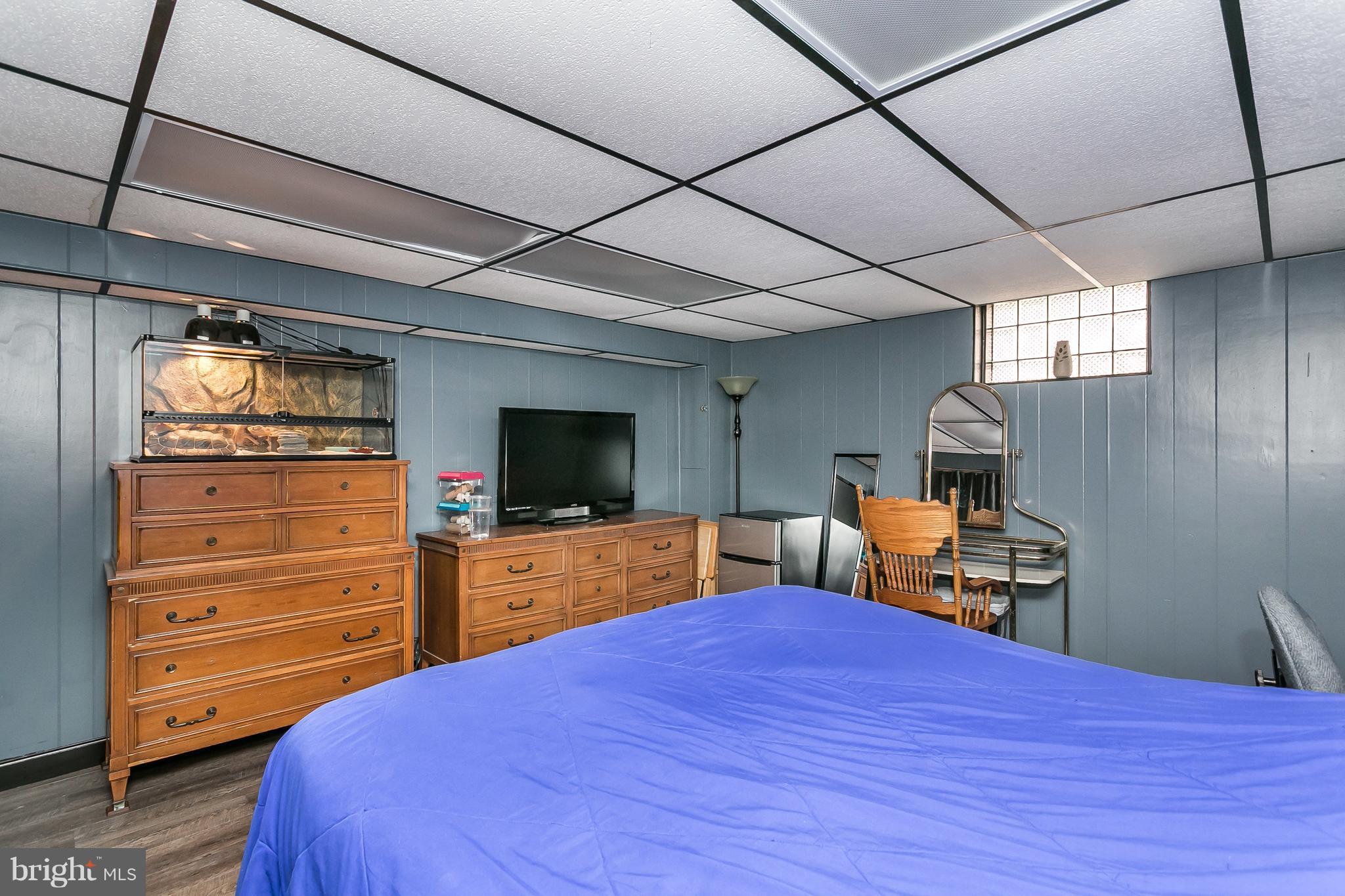 8511 Kings Ridge Road Baltimore, MD 21234 - Photo 23 of 30 a bedroom with a bed and furniture