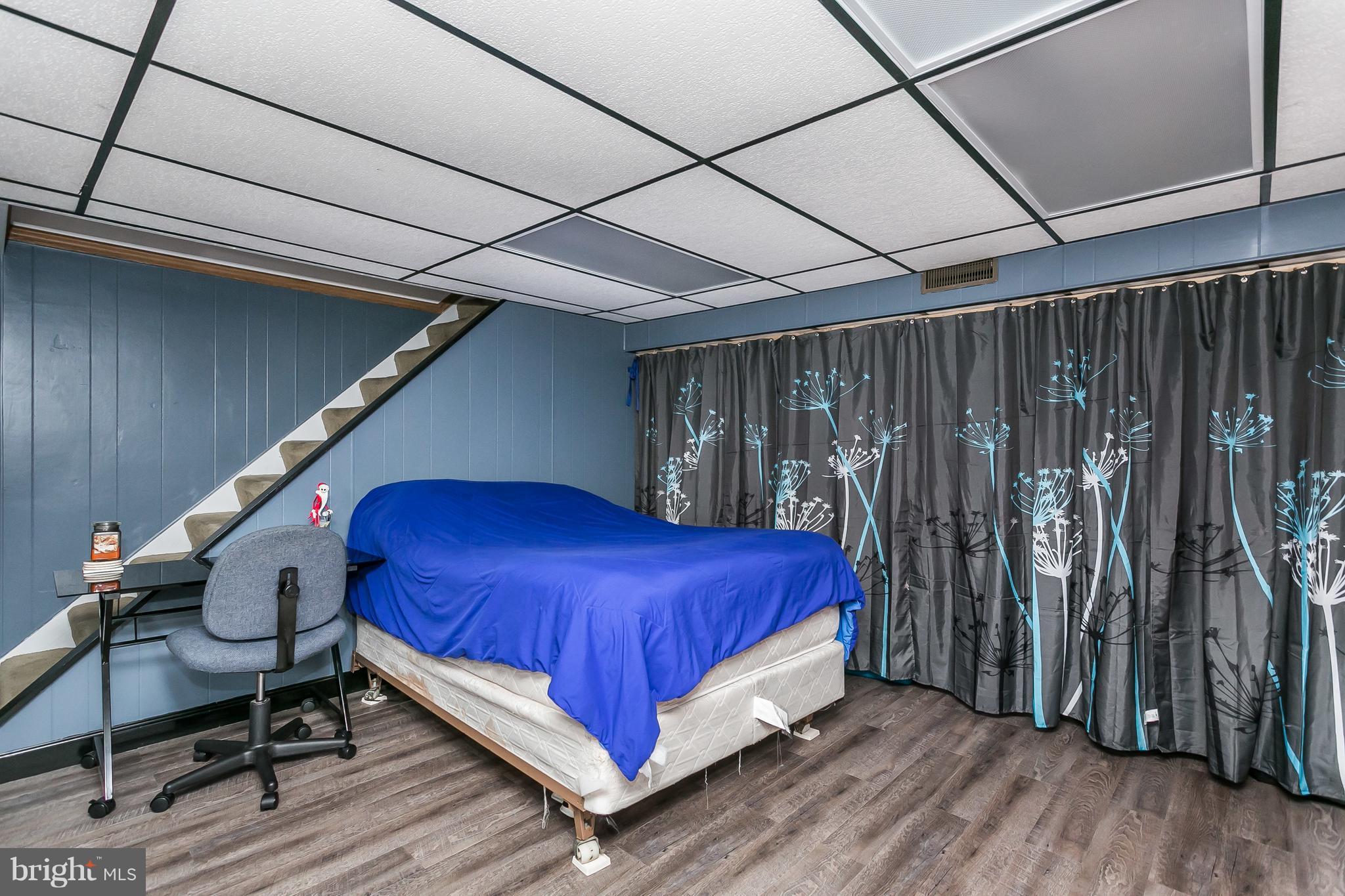 8511 Kings Ridge Road Baltimore, MD 21234 - Photo 24 of 30 a bed room with a bed and a chair
