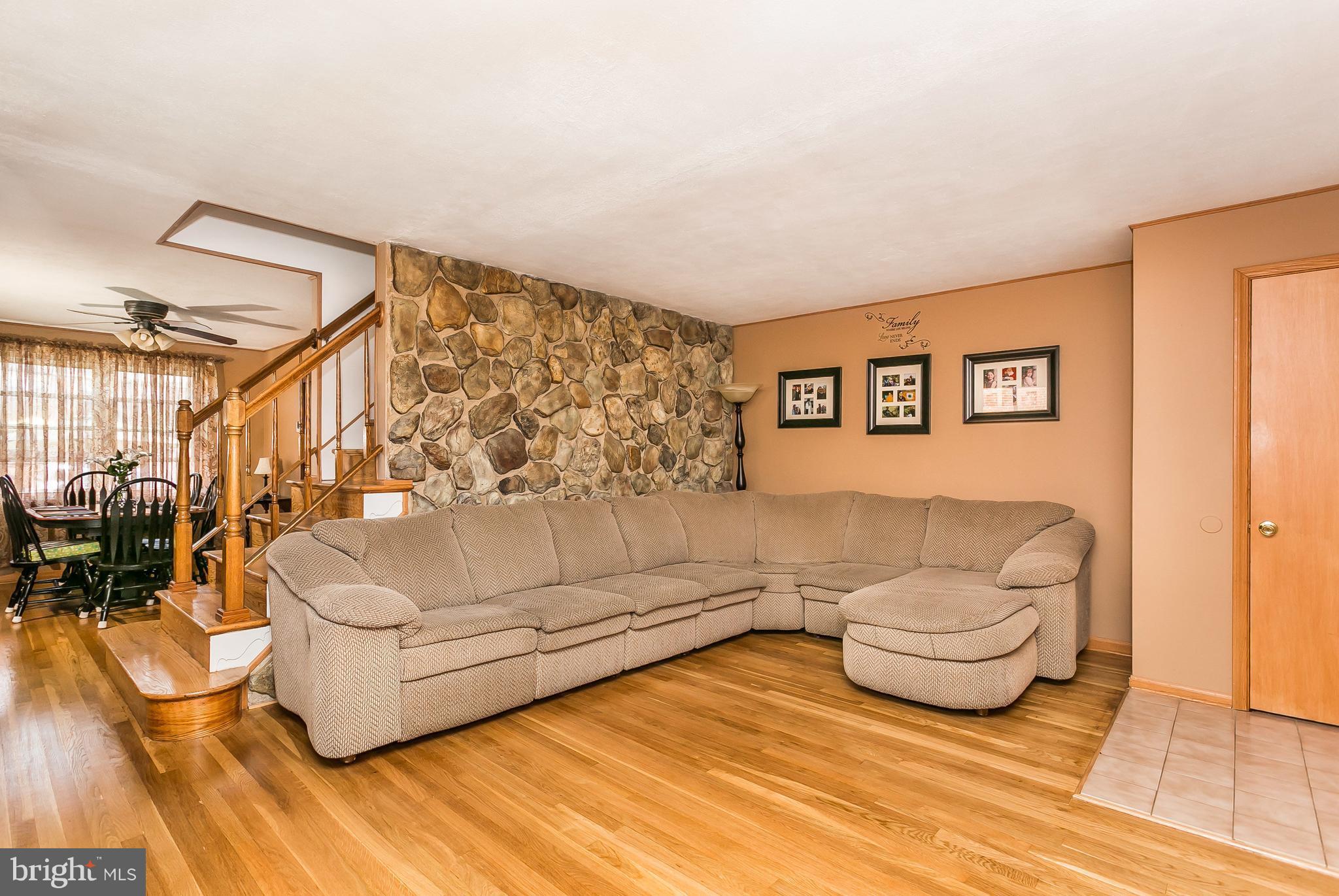 8511 Kings Ridge Road Baltimore, MD 21234 - Photo 4 of 30 a living room with furniture and a wooden floor