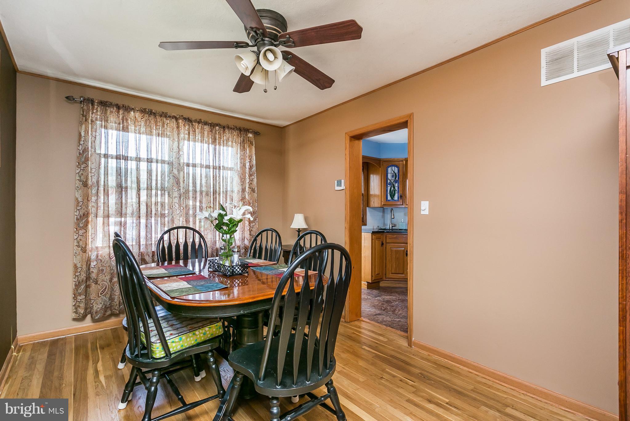8511 Kings Ridge Road Baltimore, MD 21234 - Photo 6 of 30 a view of a dining room with furniture window and wooden floor