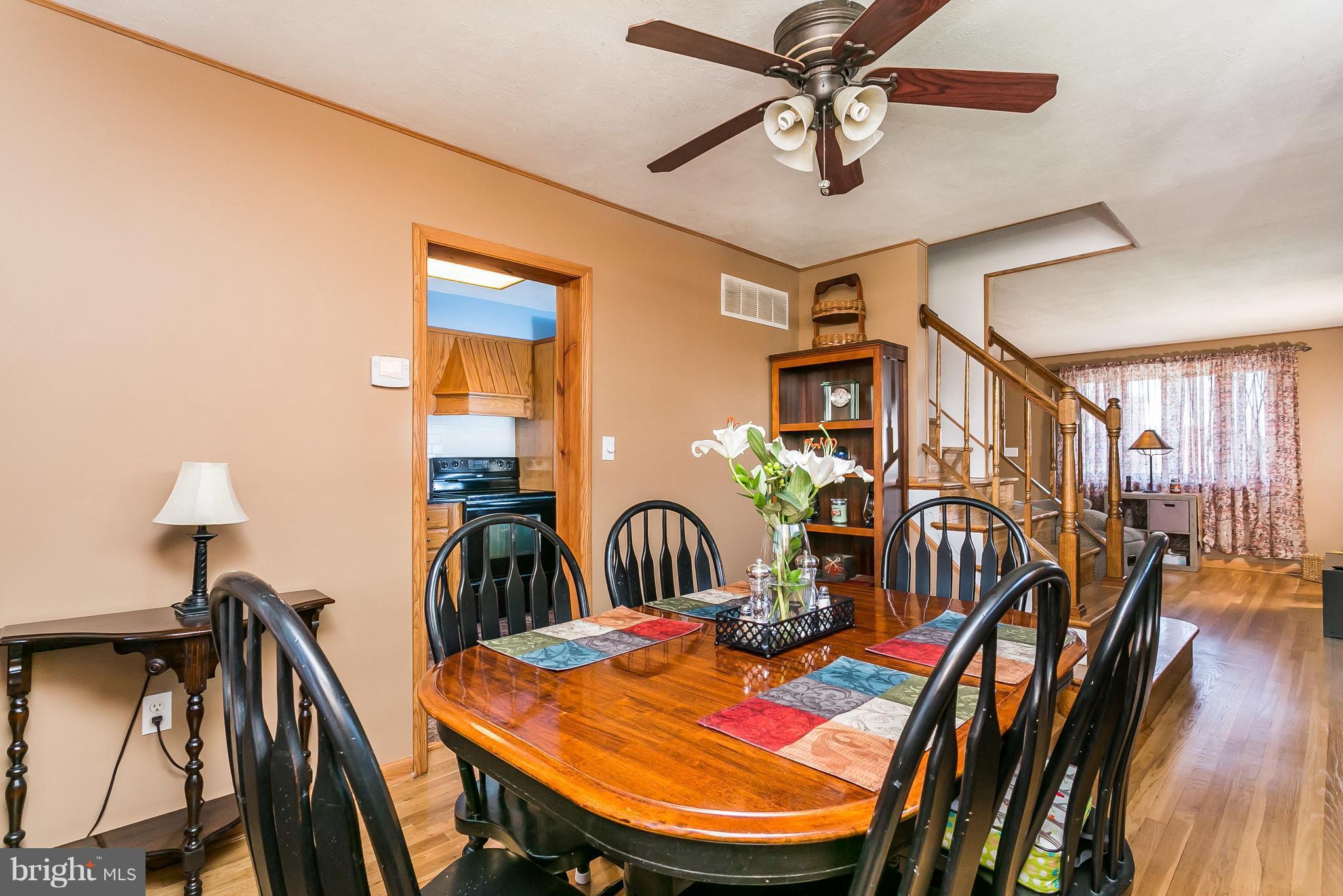 8511 Kings Ridge Road Baltimore, MD 21234 - Photo 7 of 30 a view of a dining room with furniture and wooden floor
