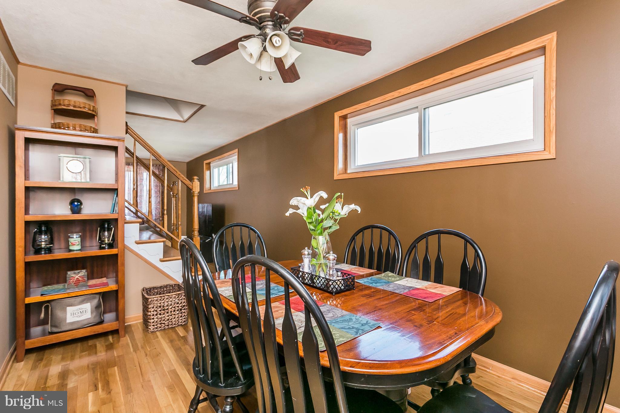 8511 Kings Ridge Road Baltimore, MD 21234 - Photo 8 of 30 a dining room with furniture and wooden floor
