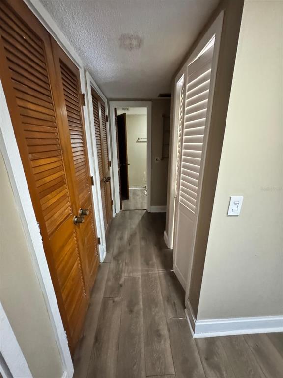 2241 Burnway Road, Unit 2241 Haines City, FL 33844 - Photo 19 of 20 a view of a hallway with wooden floor and staircase