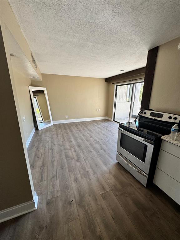 2241 Burnway Road, Unit 2241 Haines City, FL 33844 - Photo 2 of 20 a view of an empty room and wooden floor