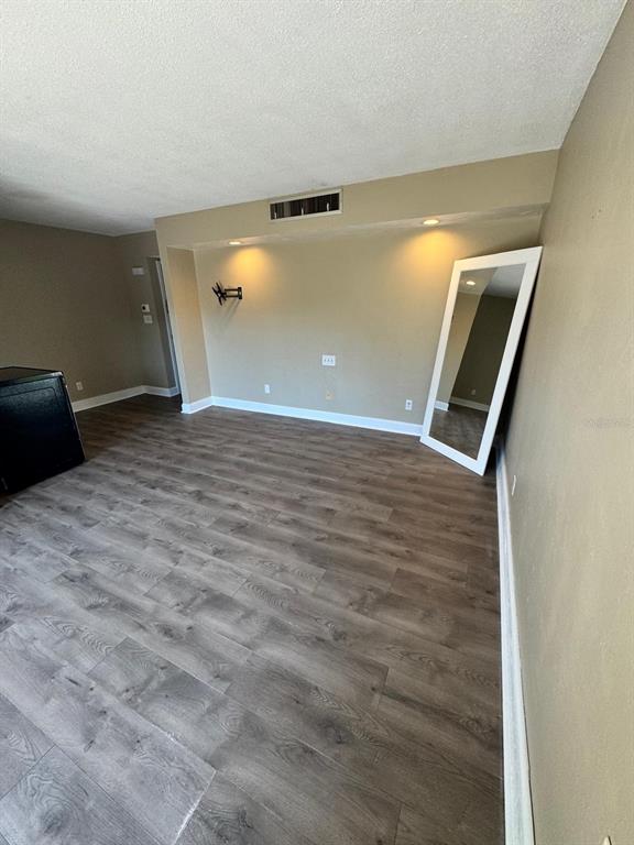2241 Burnway Road, Unit 2241 Haines City, FL 33844 - Photo 8 of 20 a view of an empty room with wooden floor