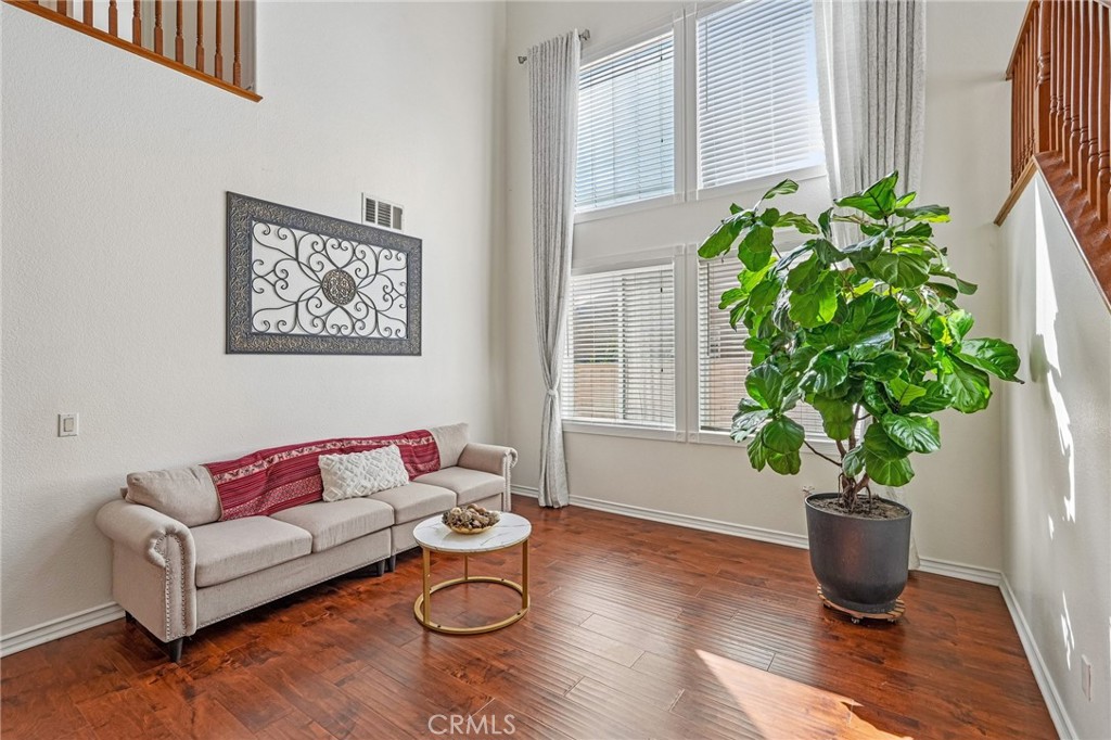 46101 Sharon Street Temecula, CA 92592 - Photo 6 of 34 a living room with furniture potted plant and a window