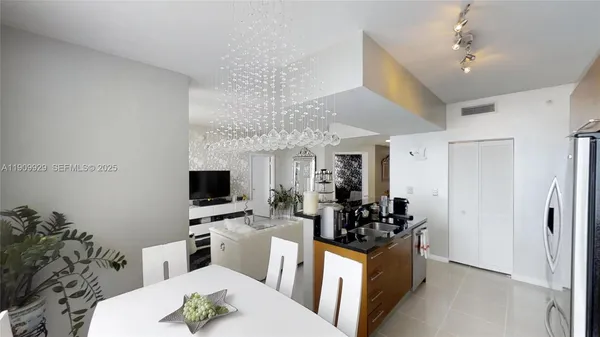 a living room with furniture a large window and a flat screen tv