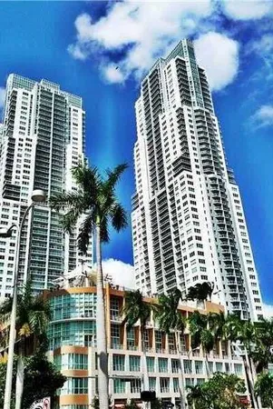 an aerial view of a house with chairs