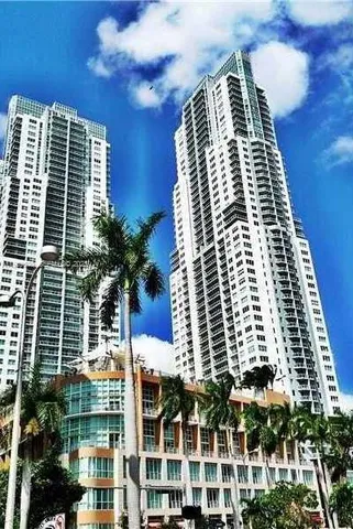 an aerial view of a house with chairs