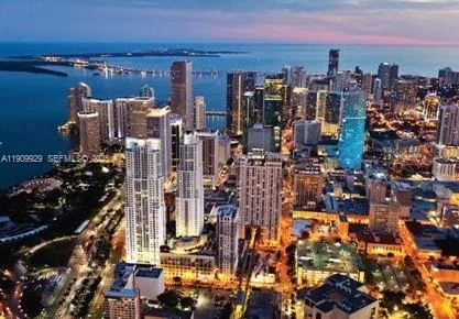 a view of a lake with couches and city view