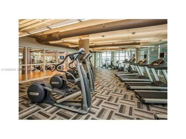 a bed with on the wall and pillows