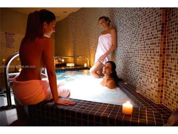 a front view of a house with entryway and wooden floor