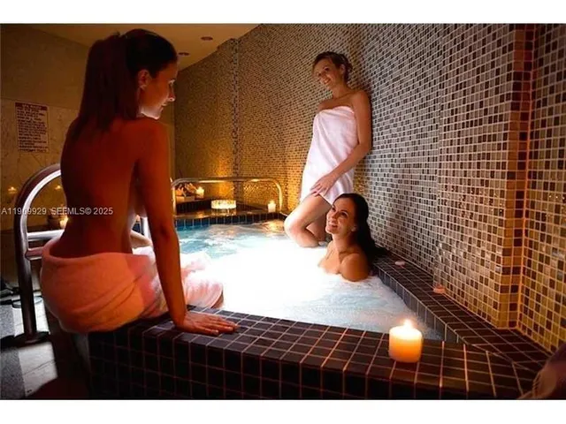 a front view of a house with entryway and wooden floor