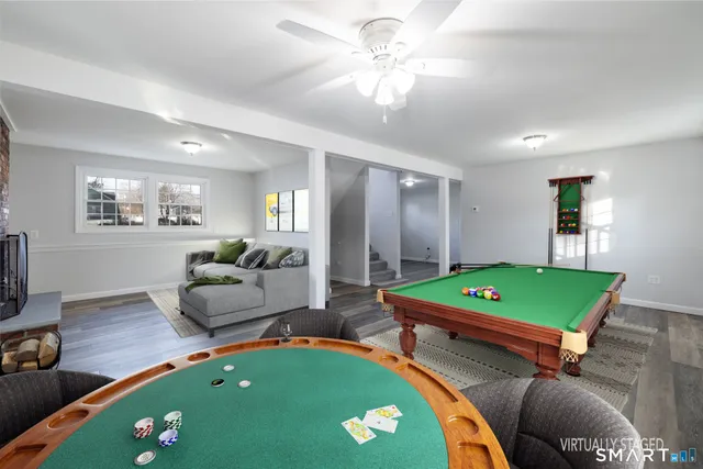 a room with furniture and a pool table