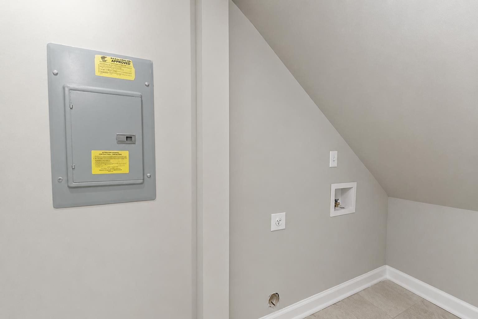 7421 Richmond Road Memphis, TN 38125 - Photo 29 of 39 Utility area featuring a circuit breaker panel, wall outlet, and plumbing hookups