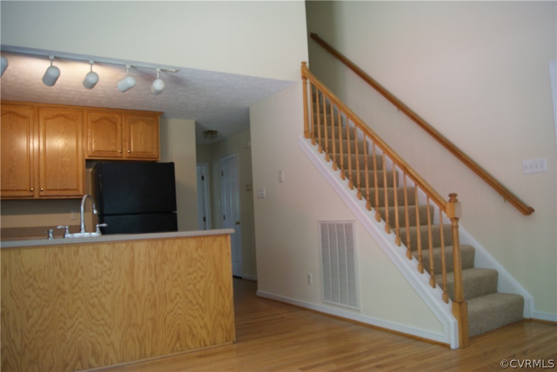 9610 Cattail Road Chesterfield, VA 23838 - Photo 9 of 17 a view of a livingroom with furniture stairs and windows
