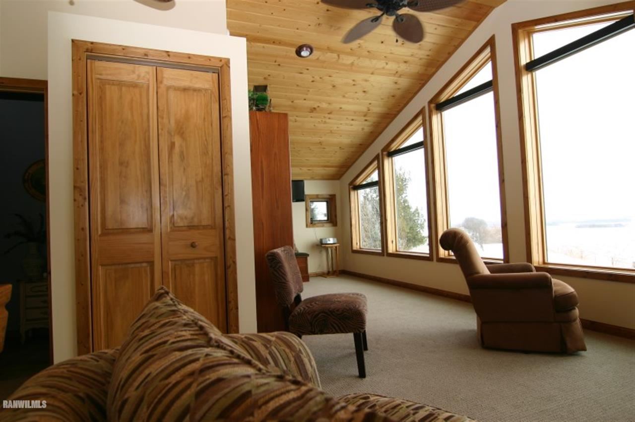 8477 West Mound Road Lena, IL 61048 - Photo 15 of 25 a living room with furniture and a large window