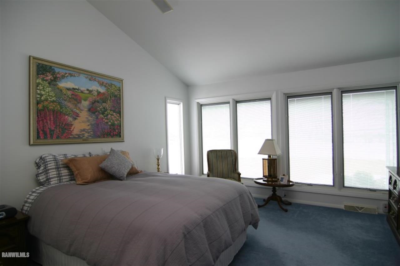 8477 West Mound Road Lena, IL 61048 - Photo 17 of 25 a bedroom with a bed and large windows