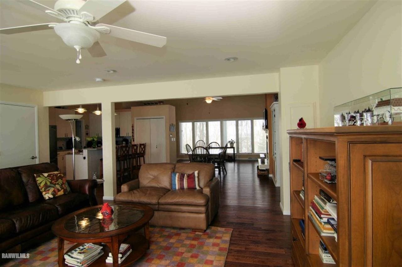 8477 West Mound Road Lena, IL 61048 - Photo 19 of 25 a living room with furniture and a chandelier