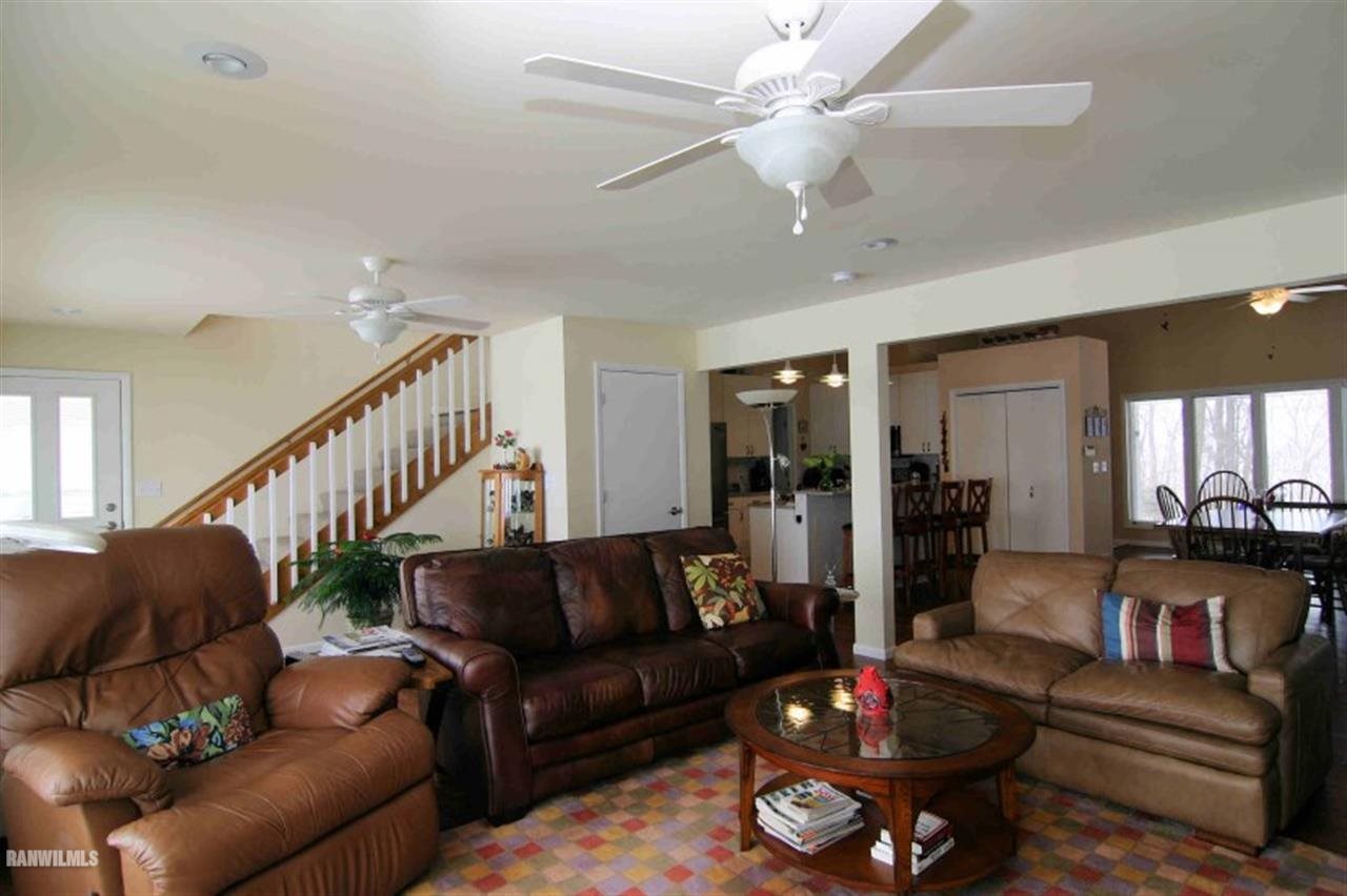 8477 West Mound Road Lena, IL 61048 - Photo 20 of 25 a living room with furniture and a wooden floor