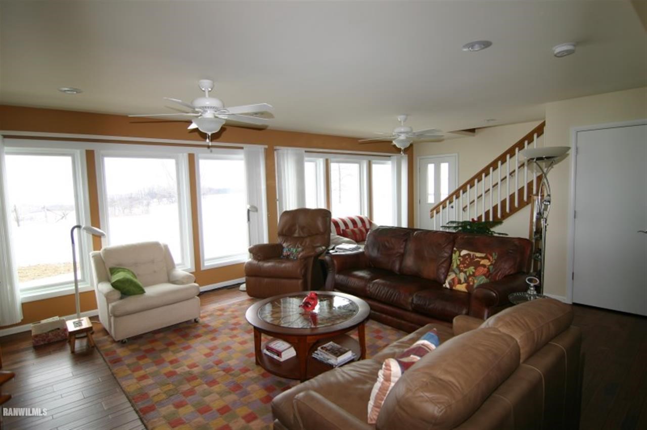 8477 West Mound Road Lena, IL 61048 - Photo 23 of 25 a living room with furniture and wooden floor