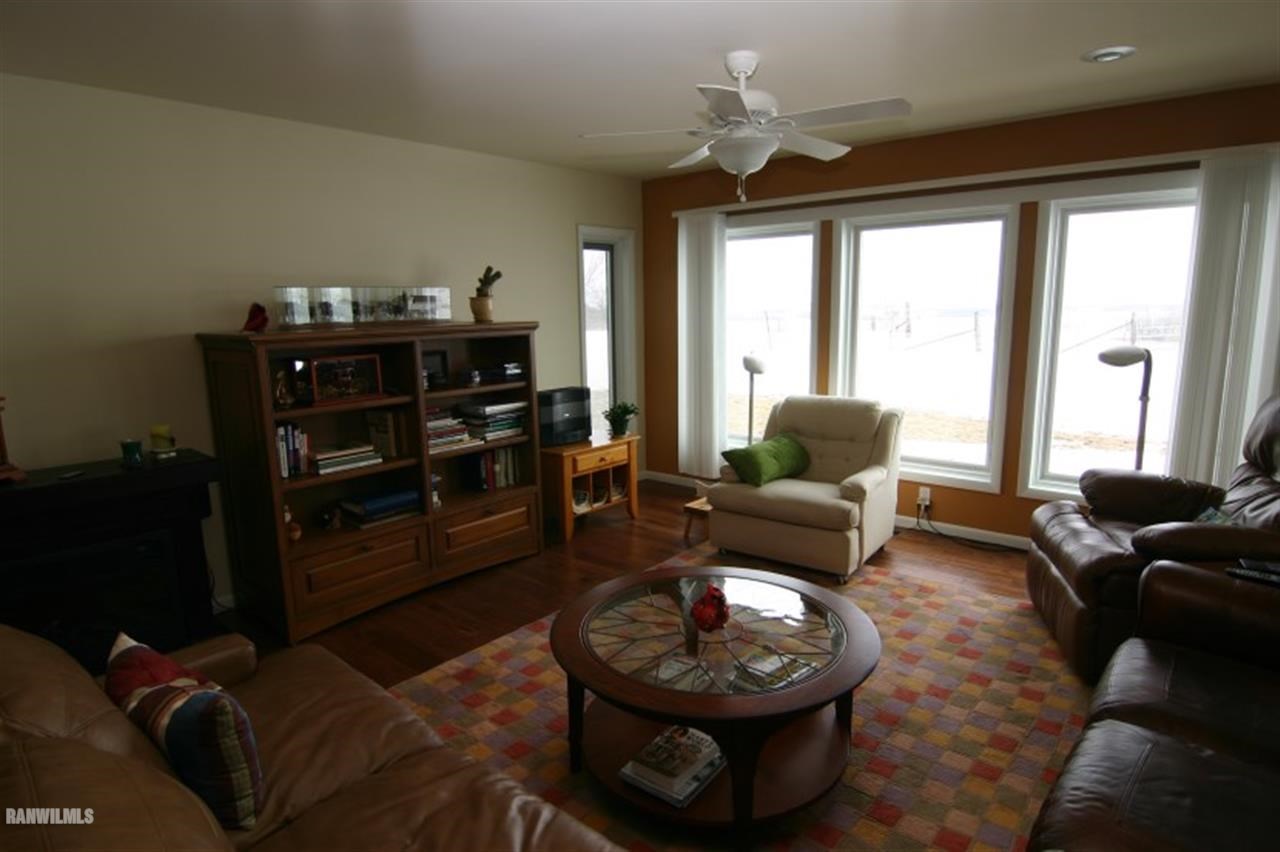 8477 West Mound Road Lena, IL 61048 - Photo 24 of 25 a living room with furniture and a fireplace