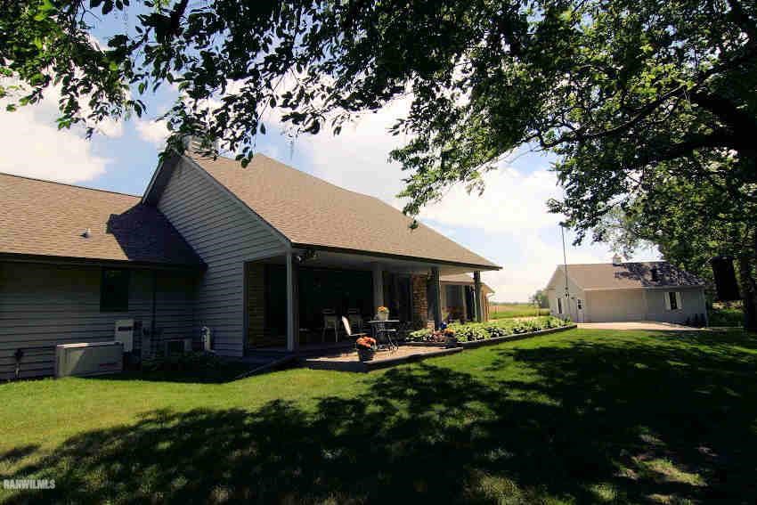 8477 West Mound Road Lena, IL 61048 - Photo 3 of 25 a view of a house with backyard and sitting area