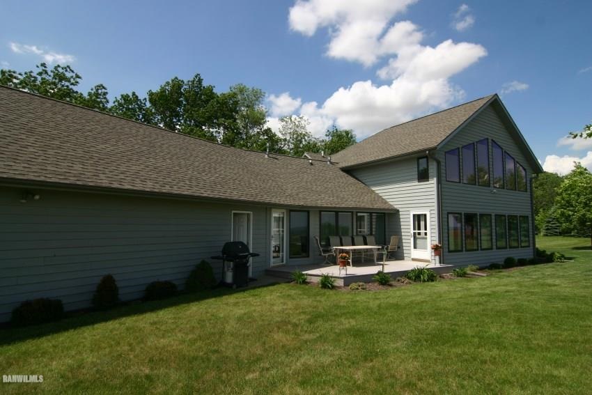 8477 West Mound Road Lena, IL 61048 - Photo 7 of 25 a front view of house with yard and outdoor seating