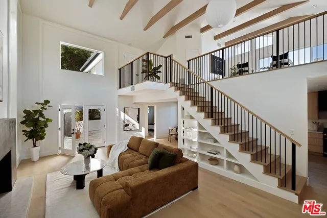 a living room with furniture or stairs and a couch