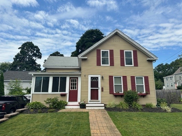 a front view of a house with garden