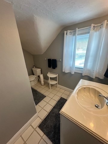 84 Lincoln Street Hudson, MA 01749 - Photo 14 of 26 a bathroom with a sink a toilet and shower