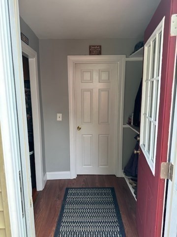 84 Lincoln Street Hudson, MA 01749 - Photo 7 of 26 a view of a closet area with furniture and wooden floor