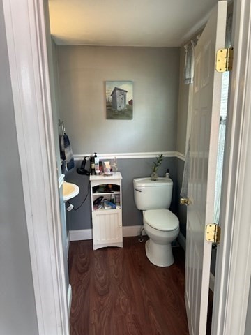 84 Lincoln Street Hudson, MA 01749 - Photo 9 of 26 a white toilet sitting next to a bathroom sink