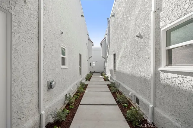 a front view of a building with a yard