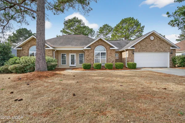 front view of a house with a yard