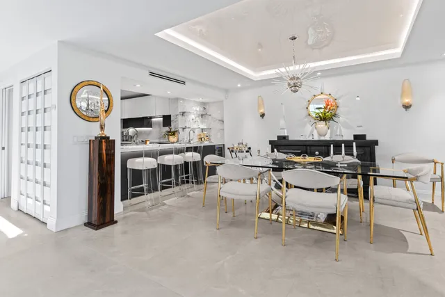 a kitchen with stainless steel appliances a stove a sink and a refrigerator