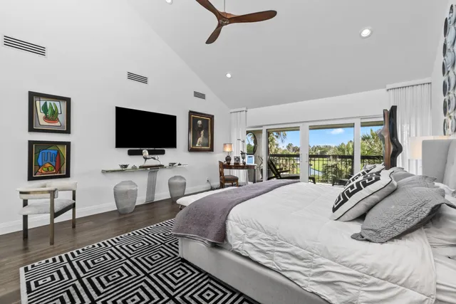 a very nice looking room with a large window and chandelier