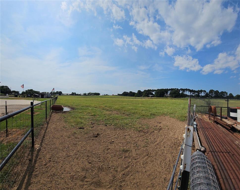 Tbd Rock Hill Road Aubrey, TX 76227 - Photo 3 of 12 a view of a lake with a garden