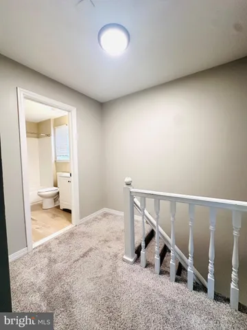 a view of a hallway with staircase