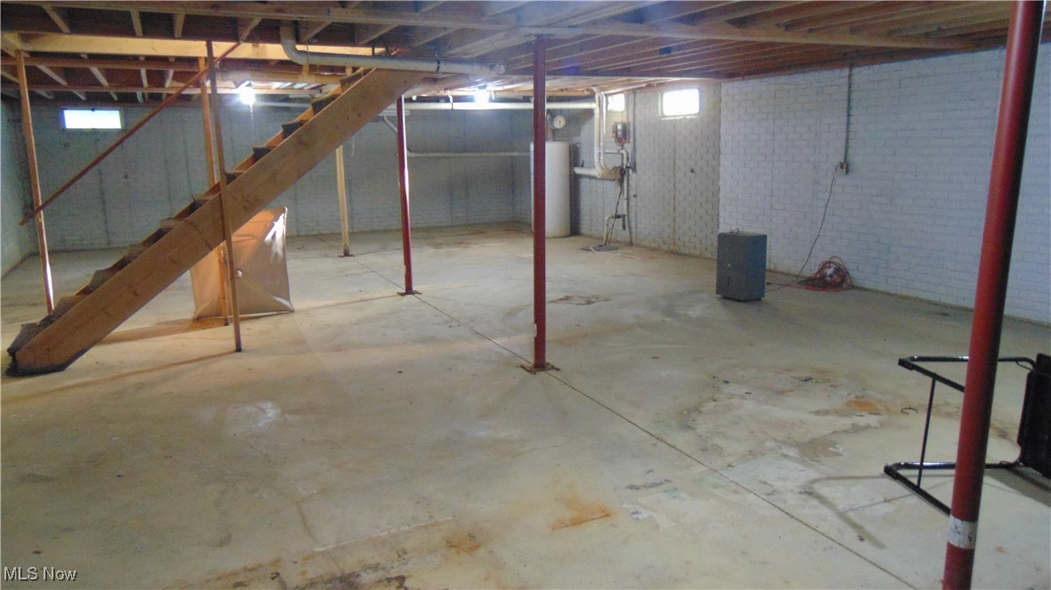 4970 Bryenton Road Litchfield, OH 44253 - Photo 33 of 33 Basement with stairway and water heater