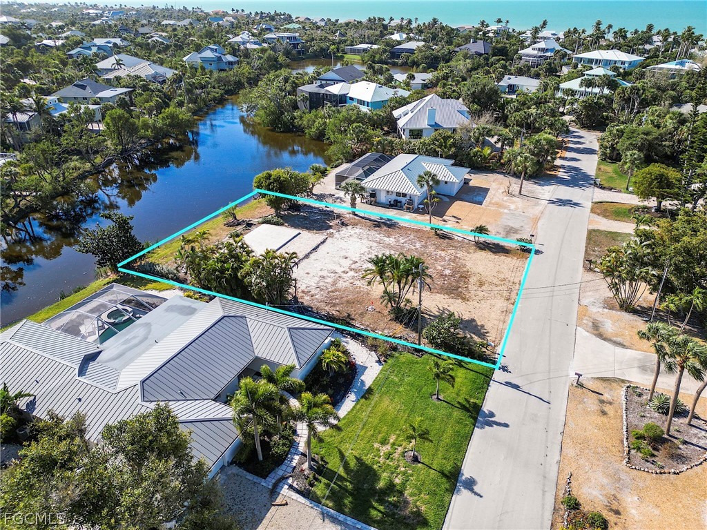1016 Fish Crow Road Sanibel, FL 33957 - Photo 2 of 12 an aerial view of a house with a lake view