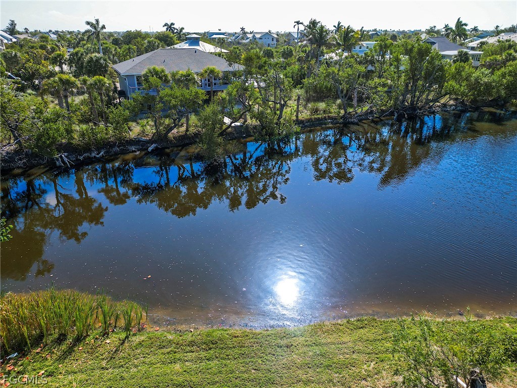1016 Fish Crow Road Sanibel, FL 33957 - Photo 3 of 12 a view of a lake in a city